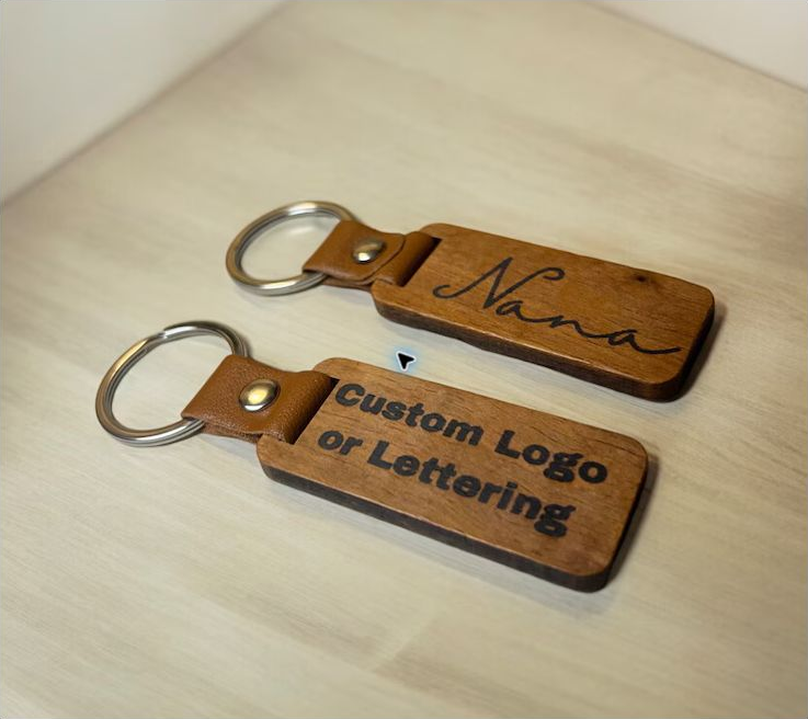 Two personalized wooden keychains